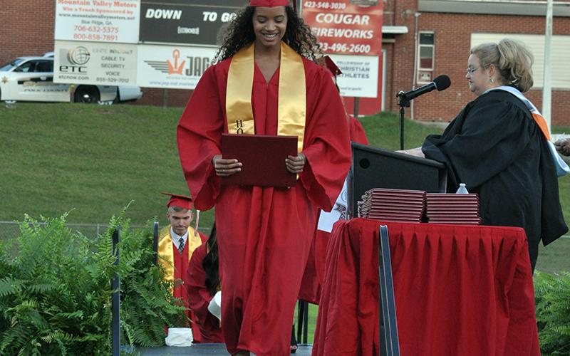 Hailey Brackett, a member of Copper Basin High School’s Class of 2020, admired her diploma Friday during the school’s graduation ceremony.
