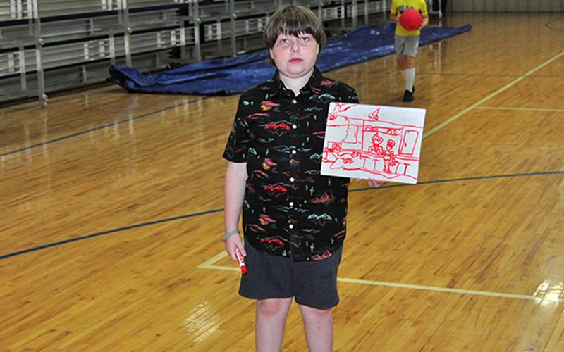 Joseph Love shows off a  drawing he drew during the Fannin County Recreation Department’s Summer Camp Wednesday, June 3.