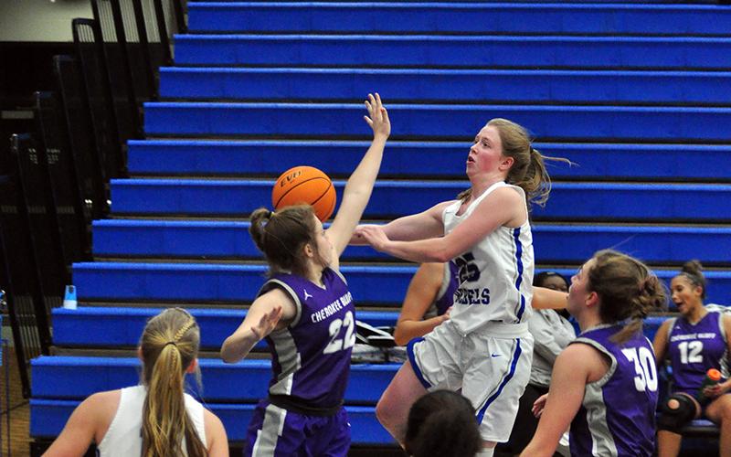 Lady Rebel Morgan Holt goes up for a contested layup this past season for the Fannin County Lady Rebels basketball team.