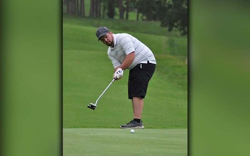 Local golfer Brett Trantham eyes a putt during the “Stars and Stripes Shootout” golf tournament Saturday, June 27.