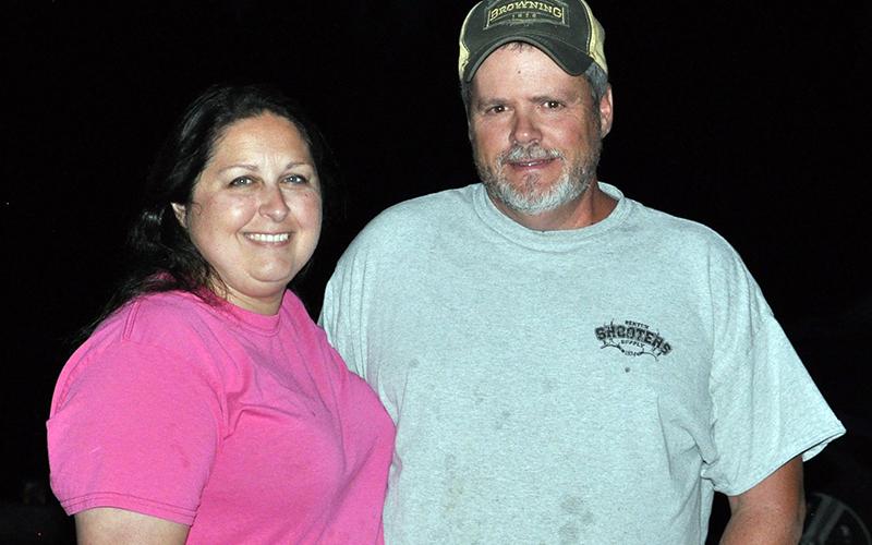 Laura and Larry Chambers smile while the fireworks lit up the sky in Ducktown Saturday, June 27.