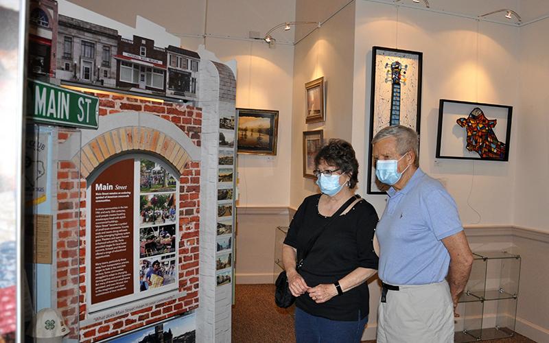 Sandra and Ron Zadroga read about Blue Ridge’s rural history during the Smithsonian Institute’s Museum on Main Street exhibition Saturday, June 20.