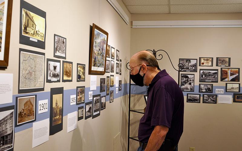 Mark Man checks out some old photographs of Fannin County during the opening of the Crossroads: Change in Rural America exhibition.