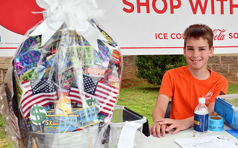 Joshua Burrell distributed raffle tickets during the 2020 Riding the Ridge to benefit the Fannin County Sheriff’s Office’s annual Shop With a Cop. Each year, Shop With a Cop works to provide a brighter Christmas for less fortunate area children. Riding the Ridge was held Saturday, June 27 with participants gathering for the start at Fannin County Middle School.