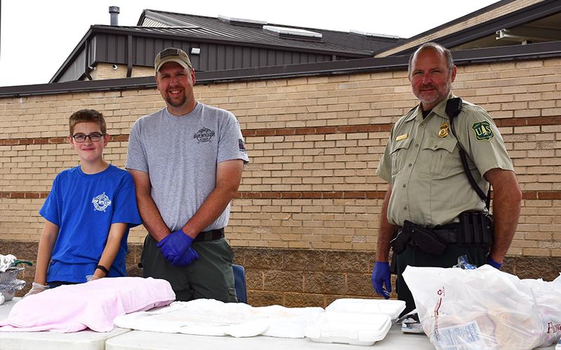The 2020 Riding the Ridge event, held Saturday, June 27, helped raise money for the Fannin County Sheriff’s Office’s annual Shop with a Cop event. Volunteers shown are, from left, James Burrell, School Resource Officer Jim Burrell and U.S. Forest Service Officer Mike Tipton.