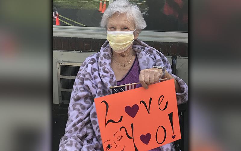 PruittHealth - Blue Ridge resident Virginia McClure told her loved ones, “Love You!” during the center’s socially distanced drive-thru parade.