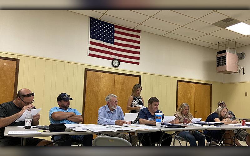 Polk County commissioners unanimously voted to pass a resolution Thursday, June 25, requesting an action plan from the Tennessee Wildlife Resources Agency (TWRA) to correct issues the county is currently facing. Shown are, from left, commissioners John Hoyt Pippenger, Jeremy Kimsey, James Woody, County Clerk Jackie Rogers (back), Dewey Esquinance, Debbie Davis, Samantha Trantham and Greg Brooks.