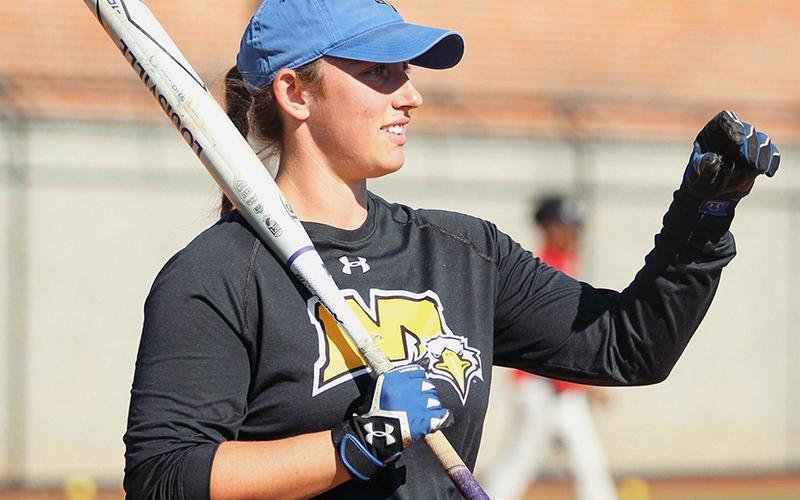 FCHS alumnus Karly Thompson warms up the team during her time as a Graduate Assistant Coach at Morehead State University.