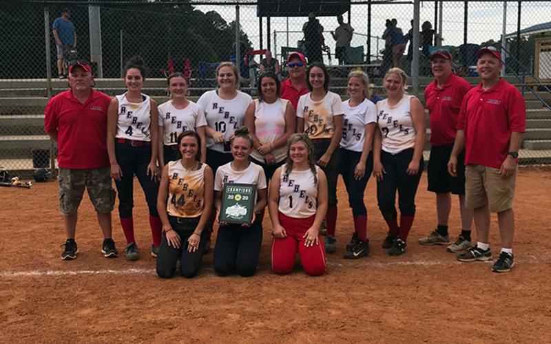 The Lady Rebels travel softball team won the World Series in Cleveland, Tennessee, Saturday, June 25 through 28. Shown, following the victory, are, from left, front, Riley Smith (Copper Basin), Payton Palmer (Hiwassee Dam) and Kaitlyn Goode (Copper Basin); middle, coach David Goode, Rylie Payne (Hiwassee Dam), Lauren Brooks (Hiwassee Dam), Allison Stiles (Hiwassee Dam), Carly Curtis (Andrews), Sydney Payne (Hiwassee Dam), Ansleigh Hogsed (Murphy), Riley Dockery (Murphy), head coach Mark Brooks and coach Sha