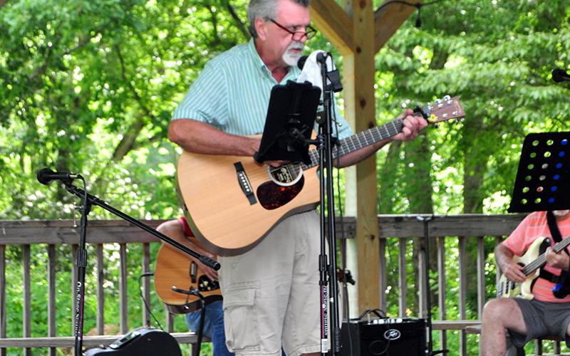 Singer and guitarist Phil Lee takes center stage during Pickin’ in the Park at Ron Henry Horseshoe Bend Park Thursady, July 9.