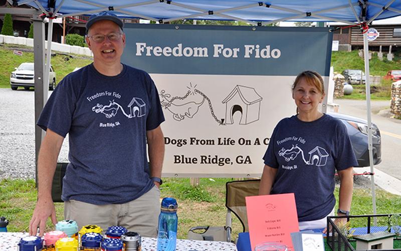 Fritz and Jackie Gilbert, founders of Freedom For Fido, were set up in Tri State Pet Rescue’s parking lot in downtown Blue Ridge Saturday, July 4, trying to raise funds for their organization.