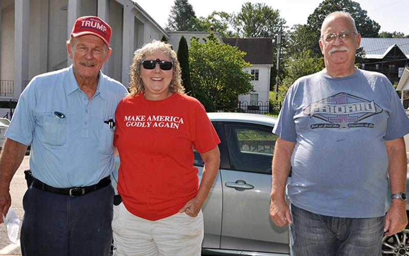 Community members met Saturday morning, July 18, for a prayer rally hosted by the Mountain Patriots. Shown are, from left, Lane and Shelley Bishop and Bob Myers.