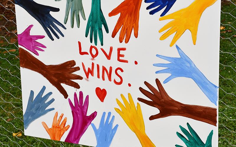 Artwork sharing the message, “Love wins” was displayed at the Silent Rally for Respect, Peace, and an Equitable Future for All in the downtown Blue Ridge city park Monday, July 6.