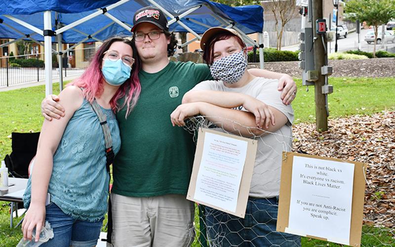 Organizers of the Silent Rally for Respect, Peace, and an Equitable Future for All included, from left, Idriya Arnold, Nathaniel Arnold and Jess Abernathy.