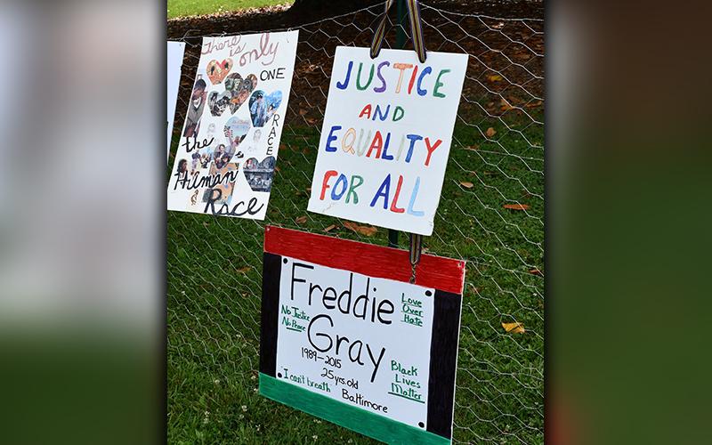 RIGHT: Artwork calling for justice and equality for black citizens was featured during the Silent Rally for Respect, Peace, and an Equitable Future for All Monday, July 6.