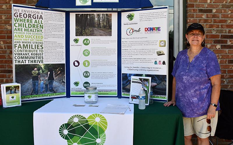 Fannin County Family Connection Executive Director Sherry Morris presented information about Family Connection during the Cars for a Cause car show fundraiser for the organization hosted by Lovin Racing and Circuit World Sunday, July 19.