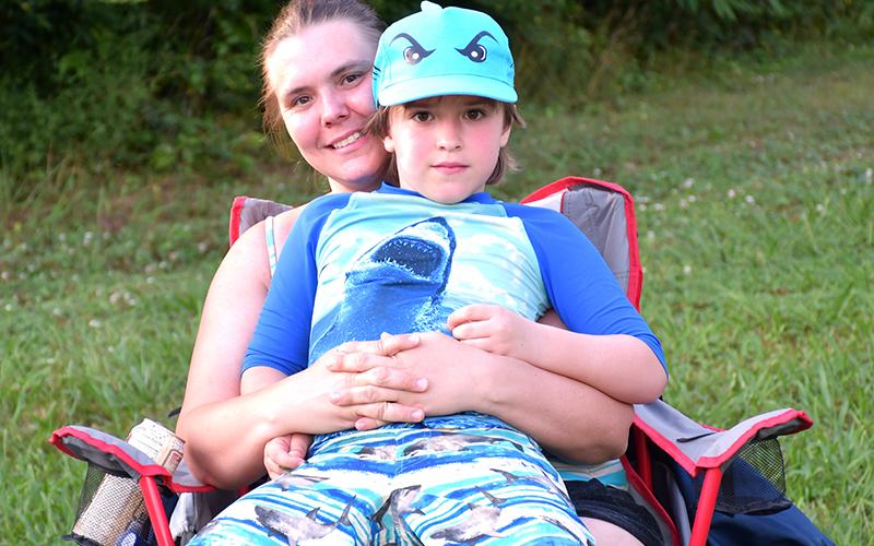Rebecca Baxter and her son, Shelton Phillips, waited for Lake Blue Ridge Civic Association’s annual Fourth of July fireworks display.