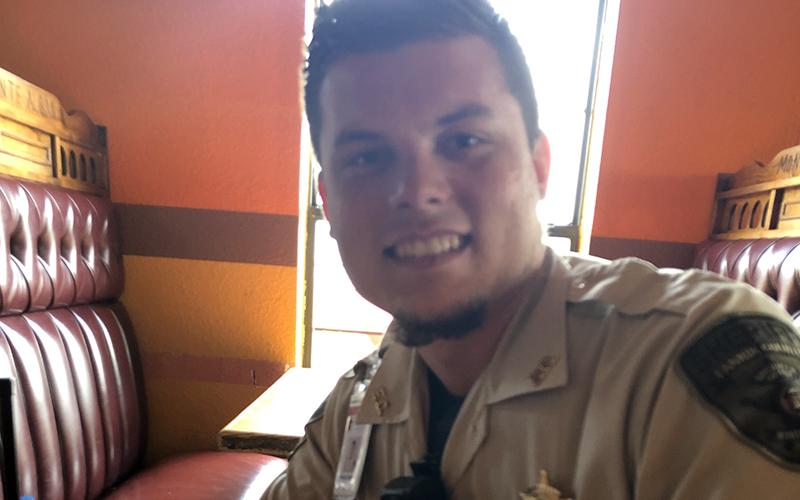Fannin County Deputy Sheriff Matthew Peardon enjoys his meal from Lacey Holloway, one result of her Back the Blue effort.