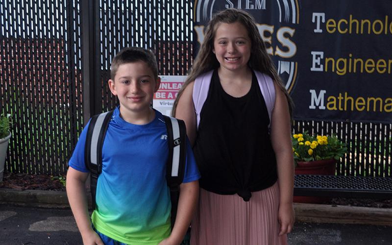 James Conner Reddit and Lyla Ann Strange smile as they walk into West Fannin Elementary School to begin the 2020-2021 school year.
