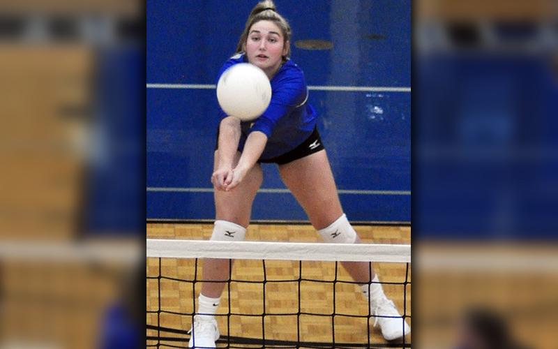 Paige Foresman keeps a volley alive during the Lady Rebels volleyball  match with Gilmer County Wednesday, August 12.