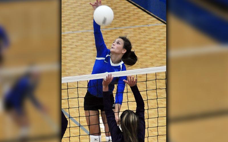 Becca Ledford spikes the volleyball for the Lady Rebels in their match against the Lady Cats Wednesday, August 12.