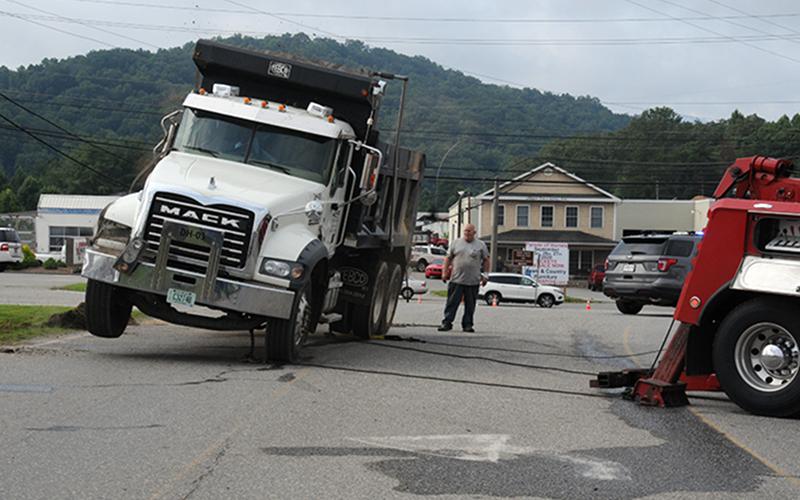 After landing on its wheels, the dump truck made quite a bounce before it came to rest.