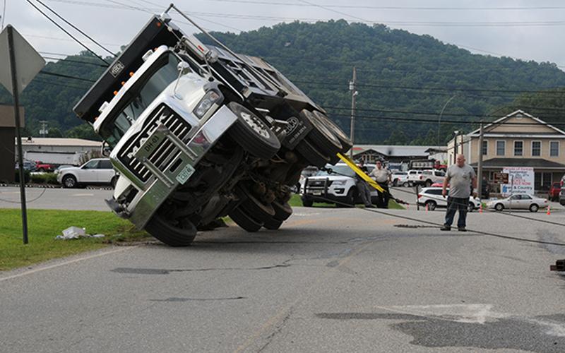 Righting the dump truck was no easy task and took Fannin Wrecker crews about an hour.