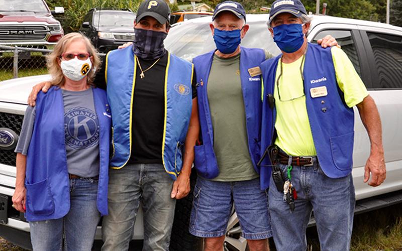 Kiwanis Club of Blue Ridge members, from left, Becky Callihan, Antonio Aiello, Bill Eckleberger and Larry Ray were few of many Kiwanis members to help out during the 25th annual Kiwanis Club of Blue Ridge and Mountain Valley Motors Rodeo Friday, August 21.