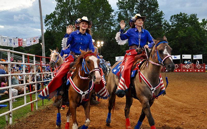 These young cowgirls made their way around the arena, getting fans excited before some bull riding.