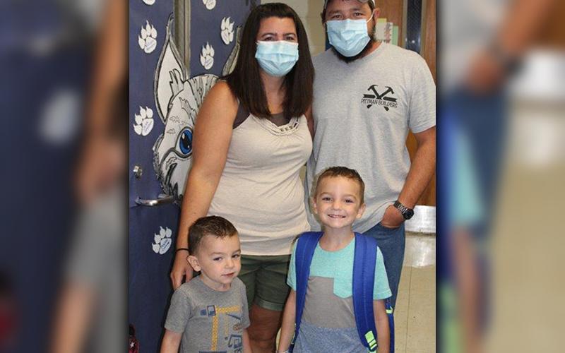 Kindergarten student Brantley Pittman, bottom right, was all smiles for his first day of the 2020-2021 school year at East Fannin Elementary School Friday, August 7. His parents, Brittney and Michael Pittman, and his younger brother, Mason, dropped him off for his first day.