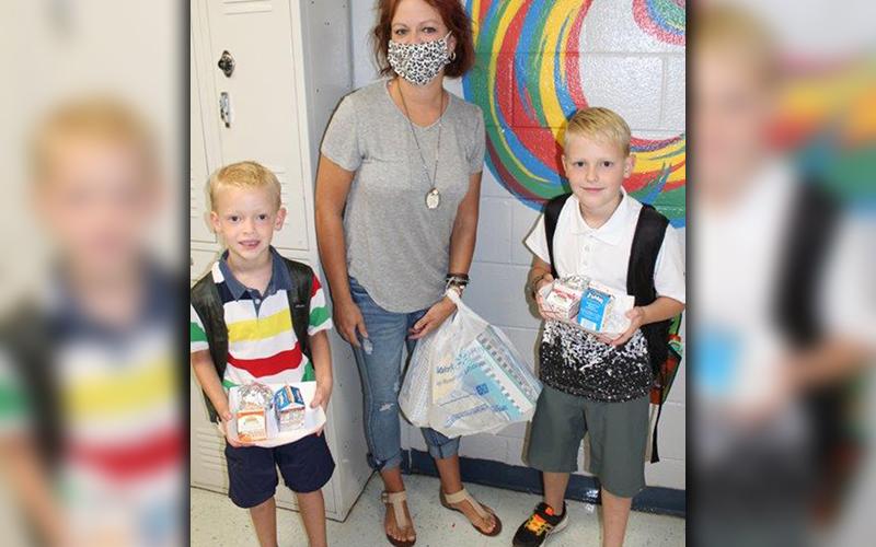 East Fannin Elementary School kiddos and their parents excitedly returned to school, Friday, August 7, for the first time since COVID-19 necessitated school closures in March. Shown are Cord Cochran, Kristy Cochran and Ty Cochran.