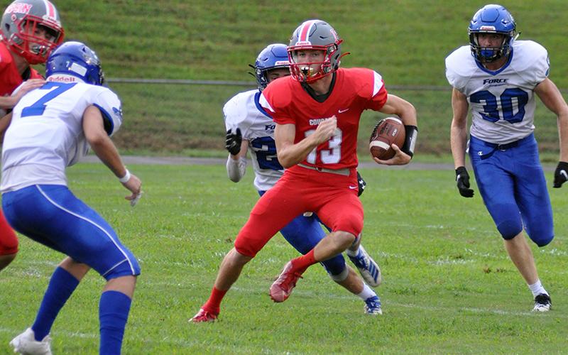 Copper Basin quarterback Bryson Grabowski jukes a defender on a quarterback keeper during the Cougars game against the Georgia Force Friday, August 28.