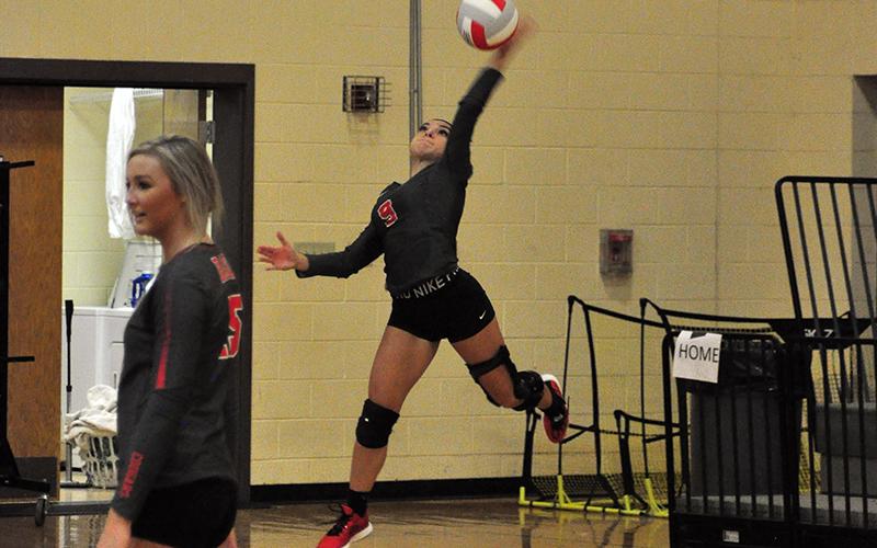 Lady Cougar Sydney Hickey serves the ball in recent action for the Copper Basin Lady Cougars volleyball team.