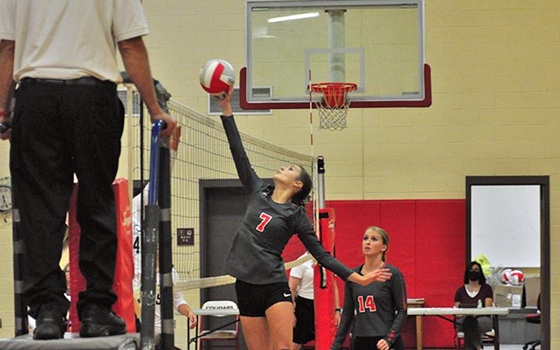 Lady Cougar Albani Dotson tips the ball over the net during Copper Basin’s match with Tellico Monday, August 24.