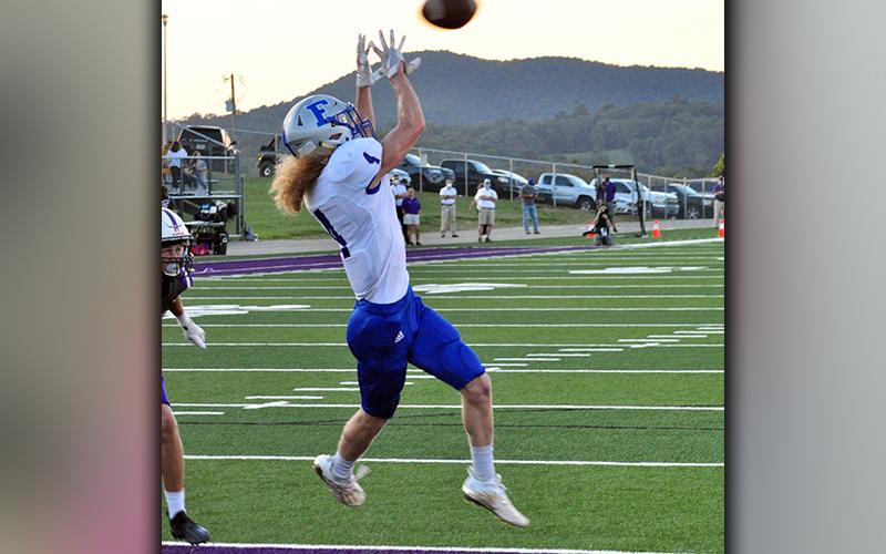 Fannin Rebel Cohutta Hyde (4) snags a touchdown pass on a slant to give the Rebels a 7-0 lead against Union County Friday, September 4.