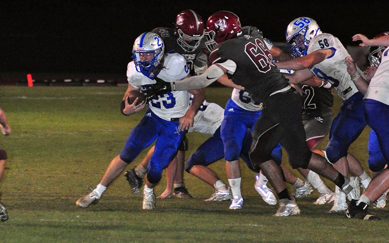 Rebel Jackson Davis (23) sheds a tackle for a score during the Rebels 48-0 win over the Southeast Whitfield Raiders Friday, September 25.