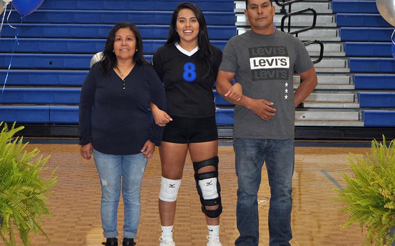 Prisila Bautista was one of five seniors honored during the Lady Rebels volleyball team senior night Thursday, September 10. She is shown with her parents Elvia and Victor Bautista.