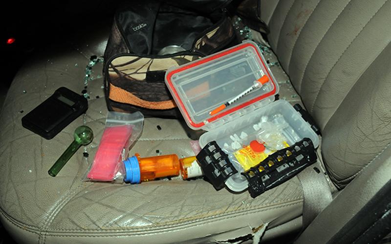Some of the drugs and related objects taken from the Martell vehicle.
