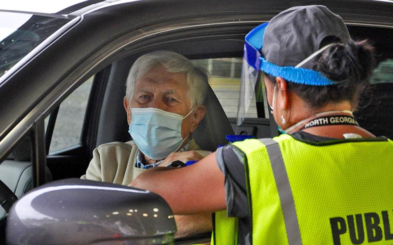 Fannin County Health Department held its annual Drive-Thru Flu Shot Clinic Thursday, September 24, which saw a large turn out. Shown getting a vaccine is Scott Macneill and administering the shot is county Nurse Manager Hollye Petty.