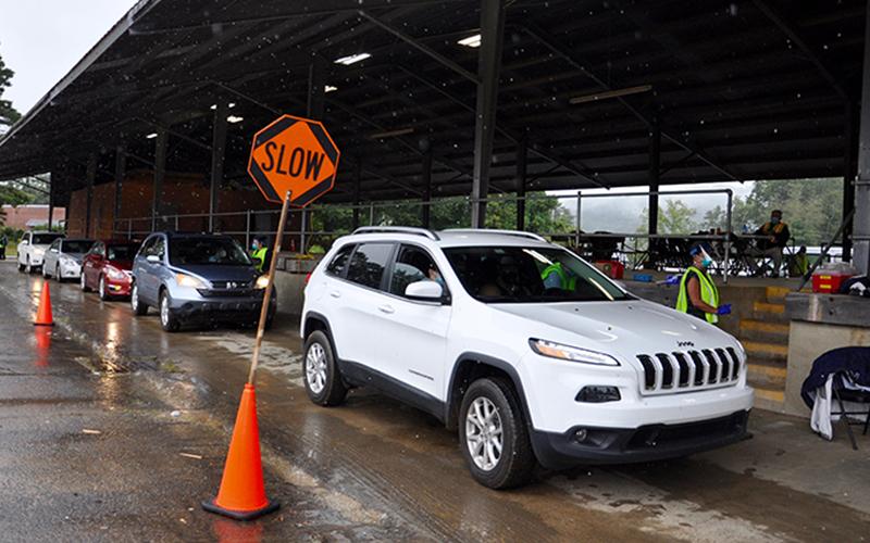 The rain couldn’t stop the parade that was a seemingless endless line of cars filled with drivers and passengers waiting to get a flu vaccine during the Fannin County Health Department’s annual Drive-Thru Flu Shot Clinic.