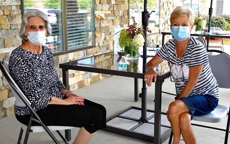 Blue Ridge Assisted Living &amp; Memory Care resident Nancy McDowell, left, and her sister, Sheryle Roach, were able to visit Thursday, September 3, while following COVID-19 guidelines thanks to the facility’s recently implemented “front porch visits.”