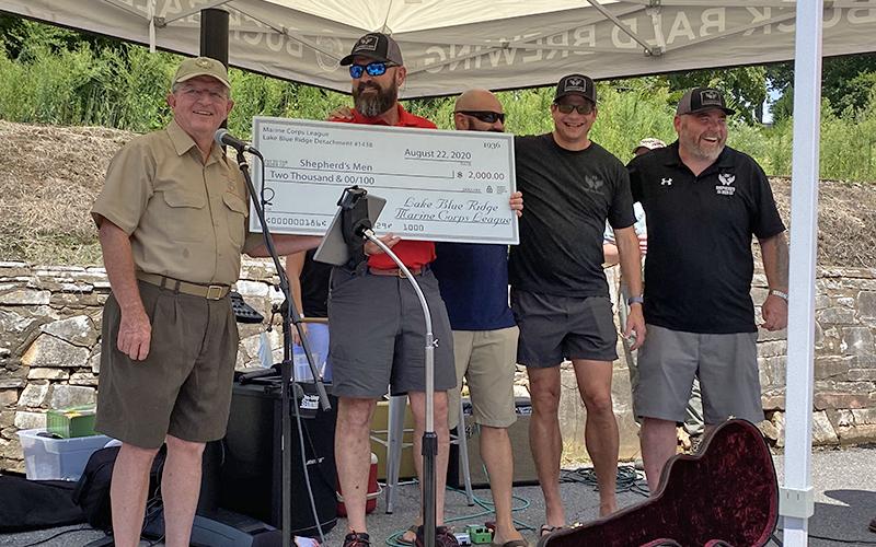 Marine Corps League Commandant Jim Brumbelow, left, presents a $2,000 check for The Shepherd’s Men’s SHARE Military Initative to The Sherpherd’s Men’s Executive Director, Travis Ellis. Standing to Ellis’ left are veterans Walter Marques, Glen Wells and Gary Herber, all of whom are successful graduates of the SHARE initiative.