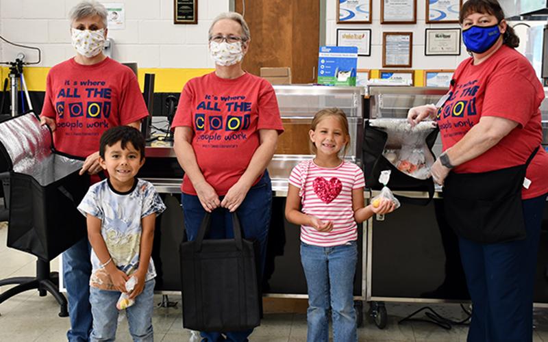 West Fannin Elementary School’s School Nutrition Program is able to distribute different fruits and vegetables as school snacks thanks to the United States Department of Agriculture’s Fresh Fruit and Vegetable Program. Shown are, from left, Nutrition Manager Amy Hawkins, student Liam Espinoza-Olvera, nutrition staff member Doris Towe, student Khloe Lee and nutrition staff member Lisa Payne.