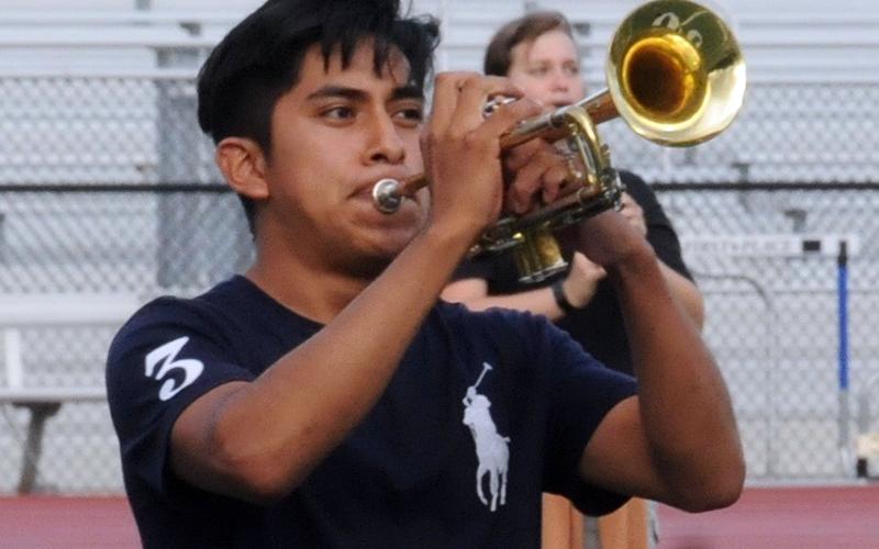 Kendel Vicente-Vicente plays his trumpet for a crowd at the first halftime performance of the year.