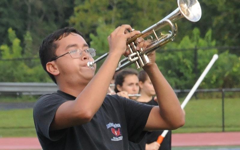 Angel Garcia performs to a crowd at the football scrimmage halftime show Friday, August 28.