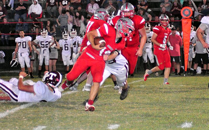 Copper Basin Cougar Sebastian Baliles (12) muscles his way through a defender in recent action for the Copper Basin Cougars football team.