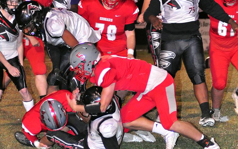 Cougars Timothy Fair (33) and Timothy Jabaley (5) stop a Falcons runner in Copper Basin’s 12-7 win over North Georgia Friday, October 16.