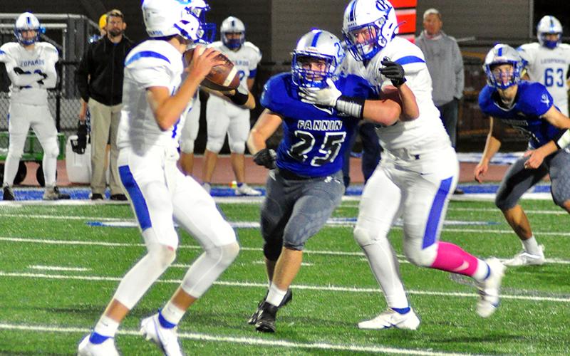 Fannin Rebel James Mercer (25) fights his way through the line of scrimmage to put pressure on the quarterback during the Rebels game against Banks County Friday, October 2.