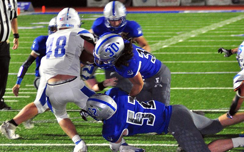 Fannin Rebels Andrew Waldrep (30) and Micah O’Neal (52) bring down a Banks County ball carrier Friday, October 2.