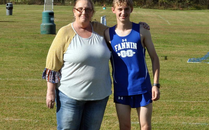 Jacob Keppel was honored with the cross country seniors before their home meet Wednesday October 21. Keppel is shown with his mother, Lucy Keppel.